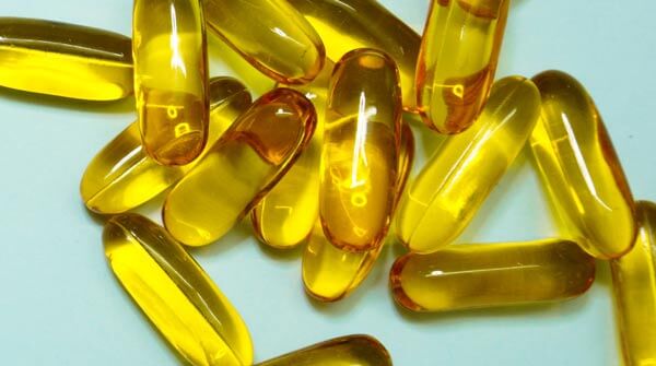 Golden capsules of Omega oils for dogs.